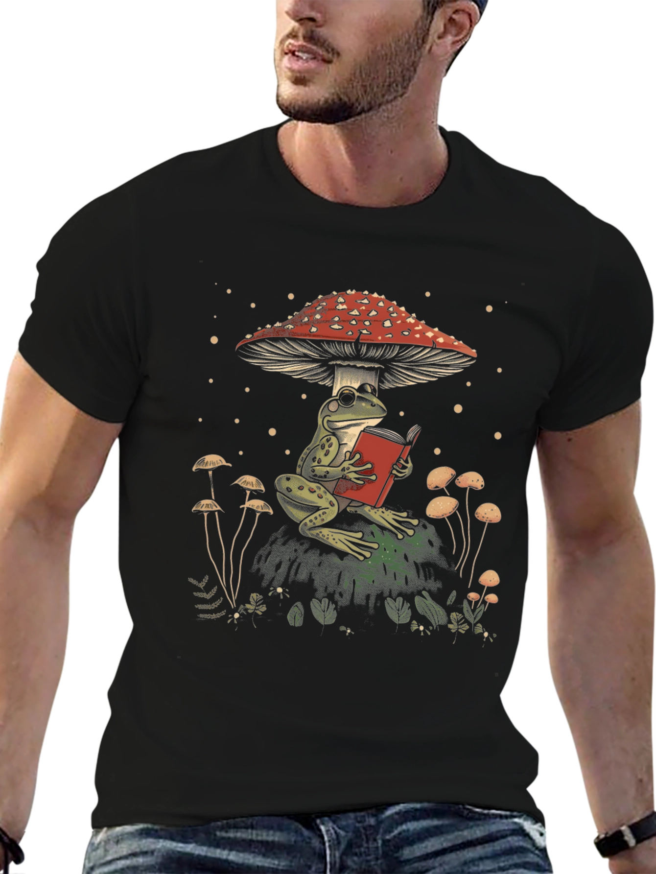 Frog Reading Under Mushroom Graphic Tee